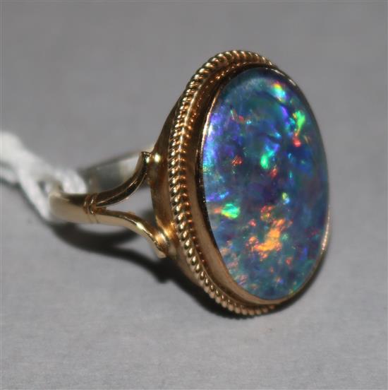 A 9ct gold black opal doublet ring